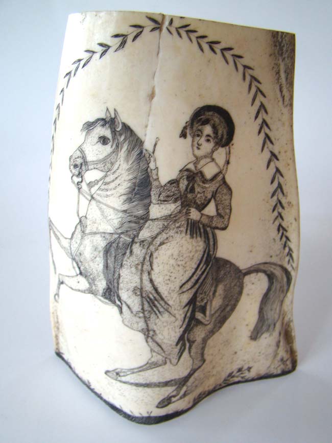 A very fine scrimshawed whales' panbone section (jawbone) depicting a lady, possibly Royaty, riding a horse, circa 1840